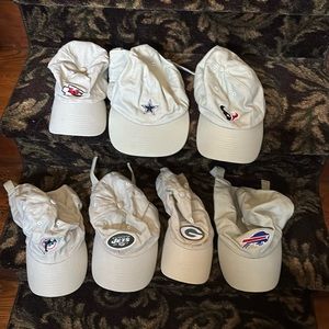 Seven NFL logo caps